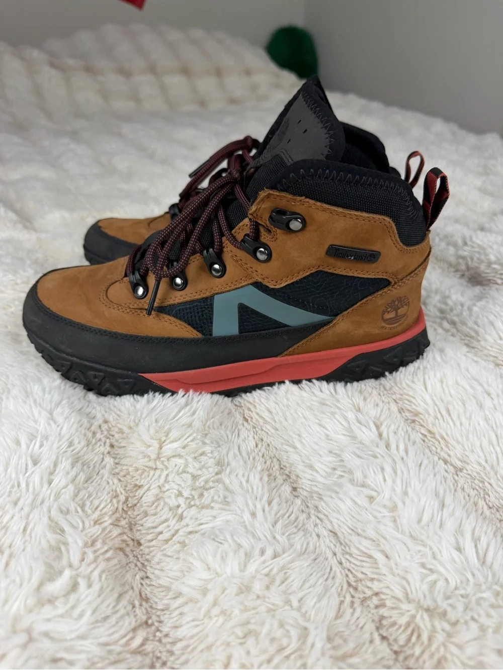 Timberland Kids Brown and Black Boots with Coral Midsole and Teal Accent